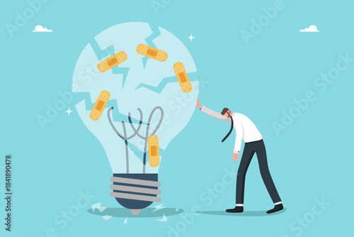 Failed of innovation, analysis and setting goals for correcting of unprofitable or ineffective business ideas, recovery from emotional burnout, tired businessman beside a patched lightbulb.