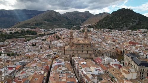 Enjoy a Scenic Aerial View of a Beautiful Historic City Surrounded by Majestic Mountains