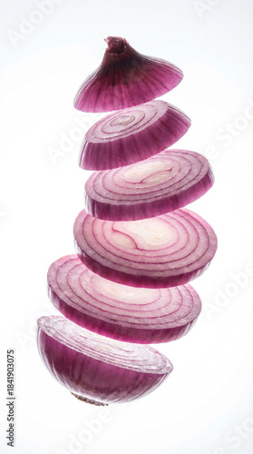 Sliced ​​red onion levitating vertically, translucent layers, white background.