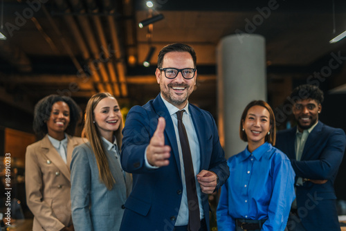 Diverse business team leader extending hand for handshake