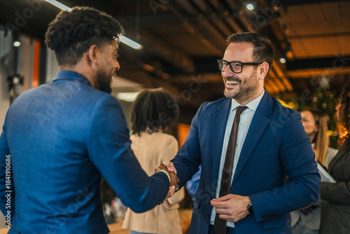 Diverse business professionals handshaking, closing successful corporate project deal