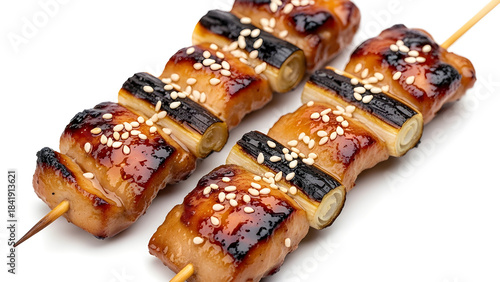 Gourmet glossy yakitori skewers with charred edges. Isolated on White background.