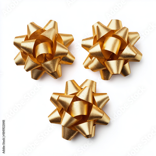 shiny gold gift bows and ribbons on white background
