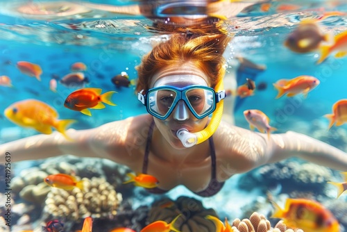 Woman Exploring Vibrant Coral Reefs While Snorkelling, Observing Colorful Fish in Tropical Waters