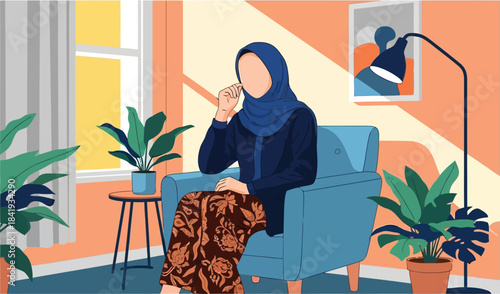 Serene Muslin in Thought: A figure, enveloped in modest attire, is engrossed in a personal phone conversation in the embrace of a comfortably styled living space.