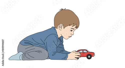 Young boy playing with a red toy car on the floor.