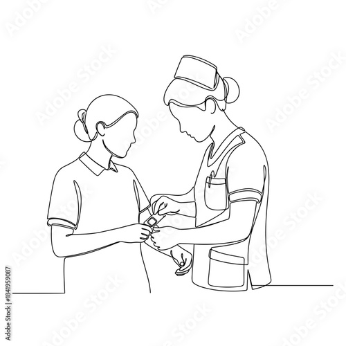 Nurse changing wound dressing for patient in healthcare setting  