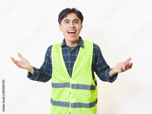 Bilde på lerret A construction worker in a safety vest reacting with a happy shocked expression against a white background, showing excitement and surprise