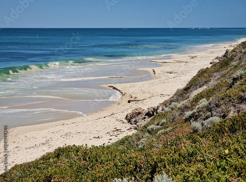 Western Australian beach and sea landscape bordering  the Indian Ocean with horizon and blue sky.