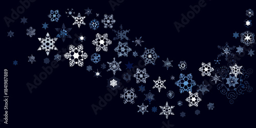 A cascade of delicate intricate snowflakes against a dark navy background