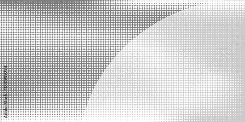 Grunge halftone background. Faded grit noise gradient texture. White and black sand wallpaper. Wide retro pixelated backdrop
