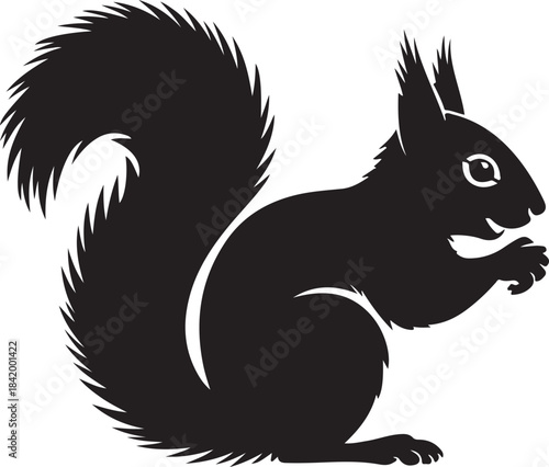 Black and white silhouette of a bushy-tailed squirrel standing on its hind legs bushy tail