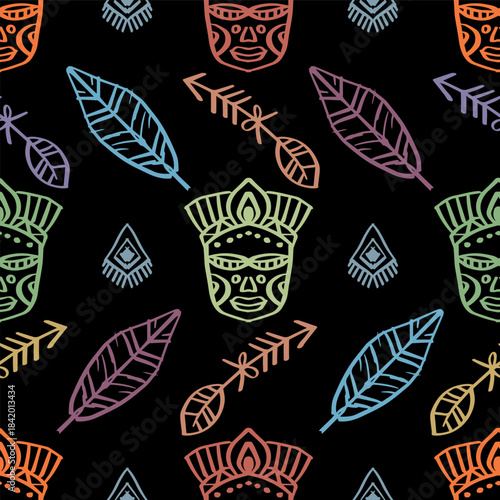 Ethnic seamless pattern with tribal mask and feathers on black background. Vector illustration.
