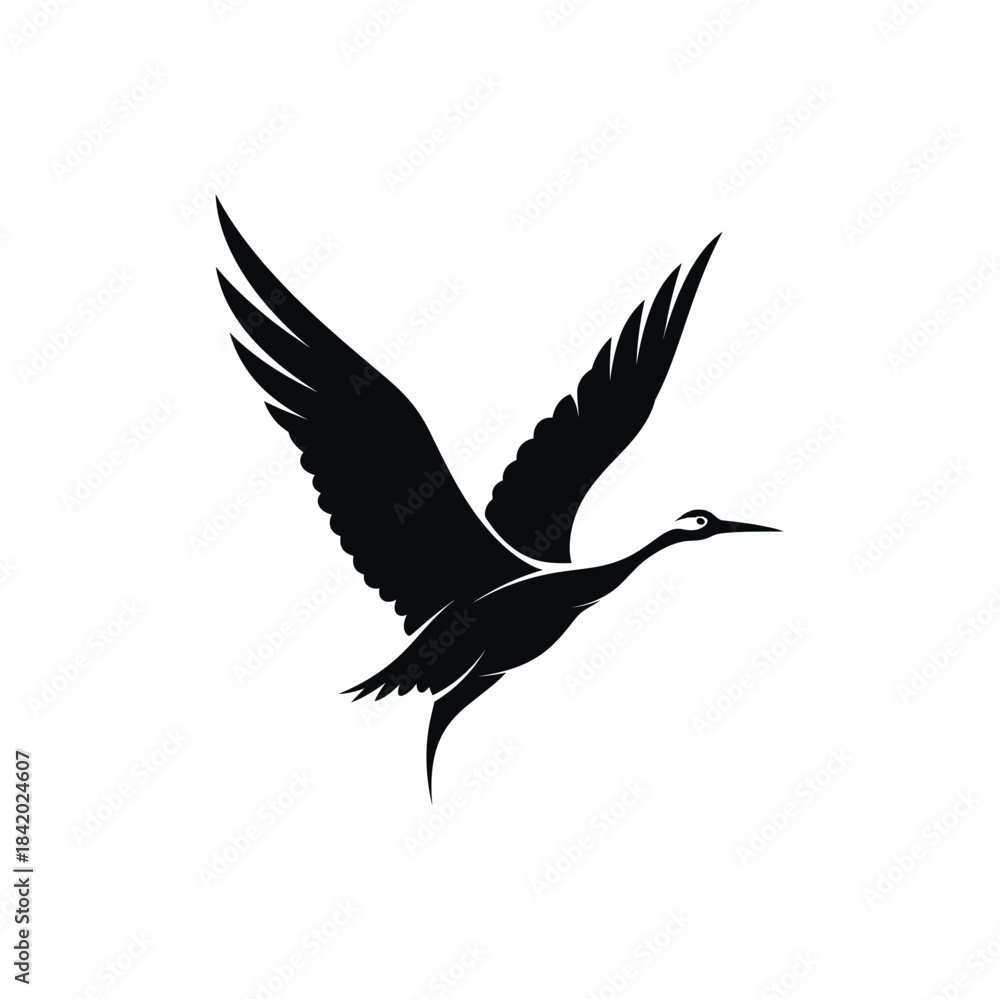 Fototapeta premium Black silhouette of a graceful crane or heron-like bird in flight with wings spread against a white background.