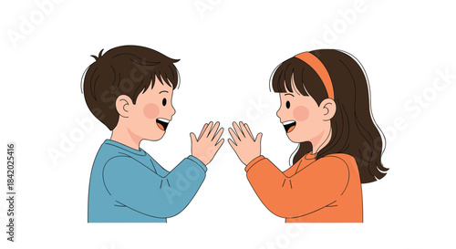 Happy young boy and girl facing each other and playing the clapping hand game patty-cake with big smiles on their faces.