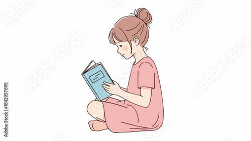 Young girl sitting cross legged reading a book.