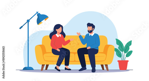 A man and a woman sitting on a yellow sofa and having a friendly conversation, with a lamp and a houseplant nearby.