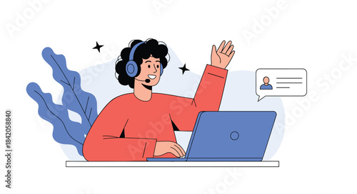 Friendly male customer service representative with a headset waving while working on a laptop, providing online support via chat.