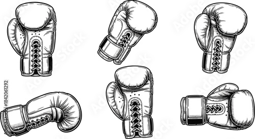 Six black and white boxing gloves in various poses and angles sport fight