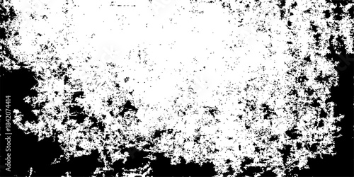 Abstract grunge black and white background texture with ink splatter and a decorative border frame design