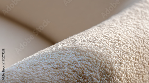 Cloud Dancer Macro view of a creamy white, textured boucle fabric, highlighting its intricate surface and softness. Colour of the Year 2026