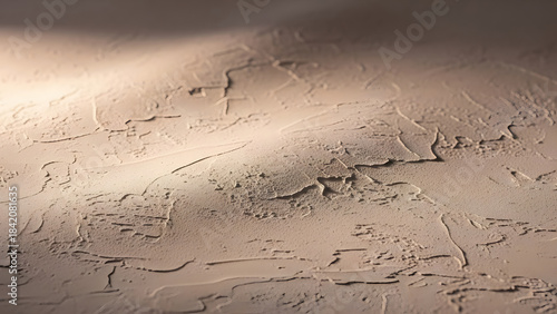 Textured Plaster Wall Surface with Dramatic Shadow Play Neutral Background for Design and Decor neutral beige plaster wall
