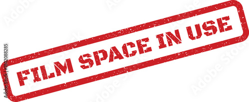Red distressed rectangular stamp featuring FILM SPACE IN USE text for location or studio alerts