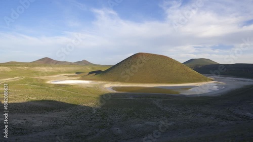 Lake Meke showing its volcanic crater formation with limited water surrounded by hills in Turkey