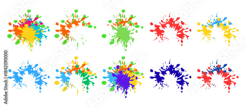 Colorful paint splatters in various hues on for creative design elements
