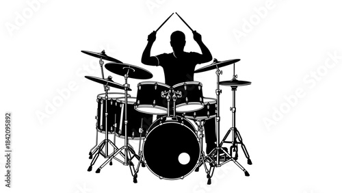 Silhouette of a person playing a drum set