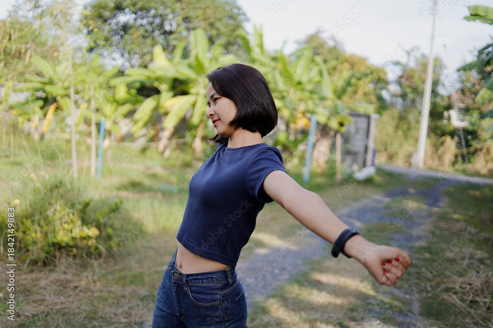 Fototapeta premium Woman stretches before exercising in the morning.