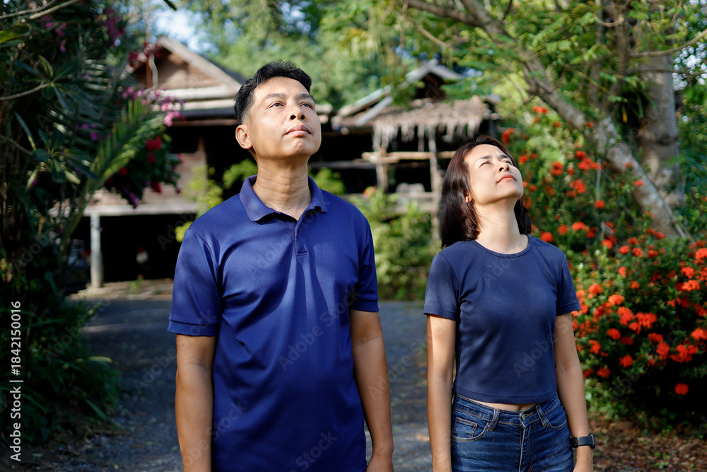 Fototapeta premium Woman and man stretches before exercising in the morning.