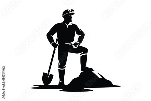 A confident miner in silhouette stands atop a mound of earth, leaning on his trusty shovel
