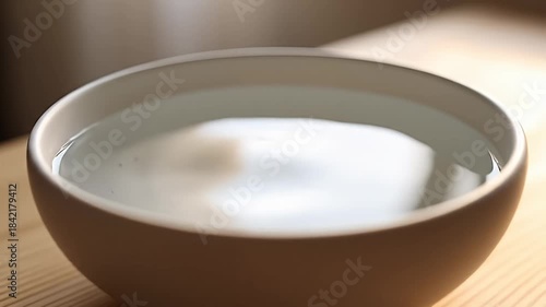 Water Droplet Ripples in Bowl - A Serene Visual Study.