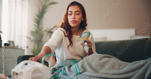 Tableau sur toile Asthma, couch and woman with nebulizer machine to inhale medicine, respiratory disease and health support