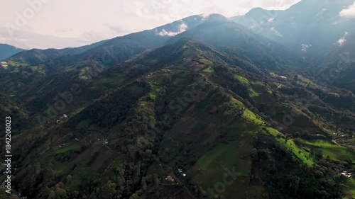 Dynamic drone footage showcasing the varied natural beauty of Baños, Ecuador: from lush, misty cloud forests and valleys to arid Andean slopes, plus scenes of rural life and wildlife.