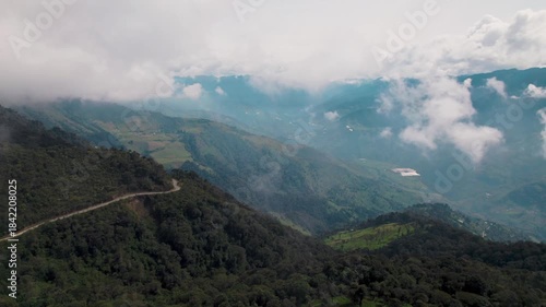 Baños, Ecuador, misty cloud forest, green Andean mountains, the valley town, and local wildlife. Ideal for travel and nature projects.