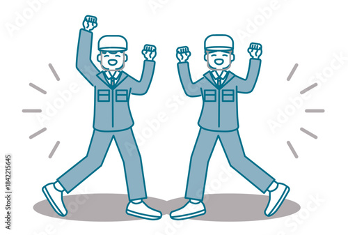 元気にガッツポーズをするヘルメットを被った作業服の男性たち