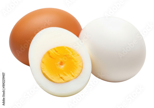 Two whole eggs and one half of a hardboiled egg isolated on transparent background