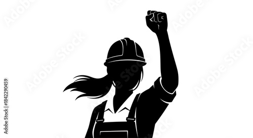 Silhouette of a Determined Female Construction Worker Raising Her Fist.