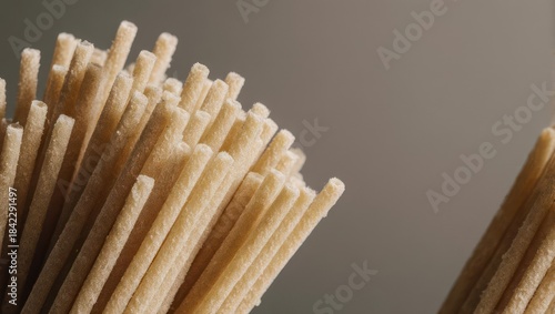 Close-up of uncooked spaghetti pasta, ready to be cooked and enjoyed.
