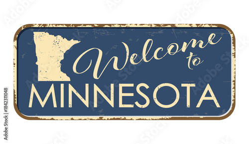 Welcome to Minnesota. A worn blue plaque with the name and outline of the state. Welcome inscription on the road sign