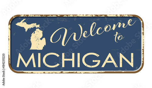 Welcome to Michigan. A worn blue plaque with the name and outline of the state. Welcome inscription on the road sign