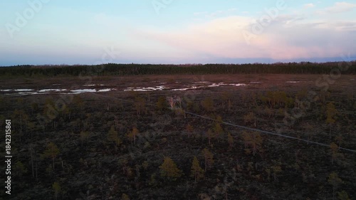 Drone footage of Riisa bog with natural wetland, ponds and forest in Soomaa National Park, Estonia.