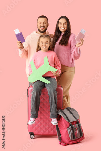 Family of travelers with pa...
