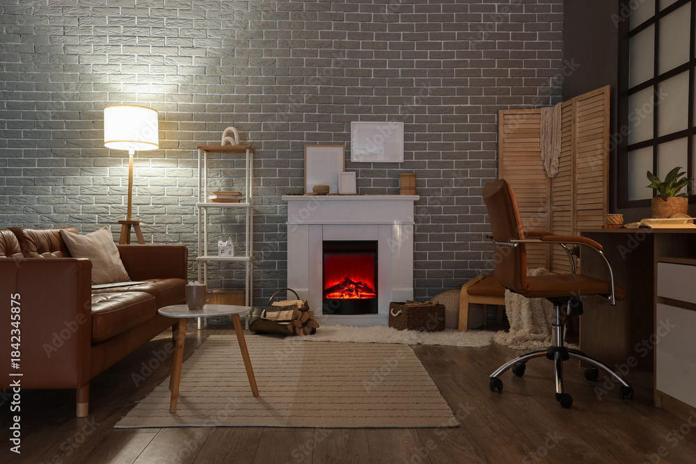 Obraz premium Interior of living room with fireplace, sofa and workplace