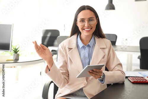 Young businesswoman with ta...