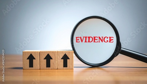 Wooden blocks ascending with magnifying glass revealing “EVIDENCE”.