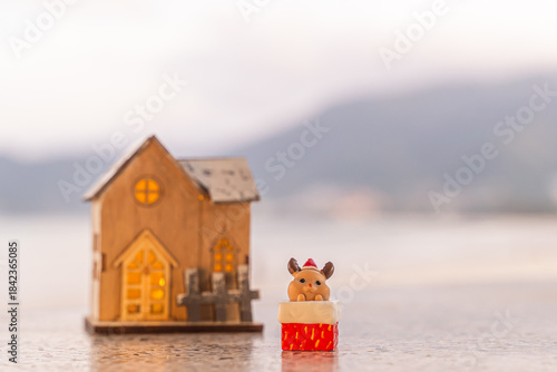 Merry Christmas word in wooden on the beach of tidewater green tone background, wide banner, Christmas banner, happy concept, copy space, soft focus Sky in the morning, Patong Beach, Phuket Thailand
