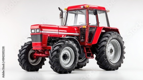Large red farming tractor displayed against a pure white backdrop